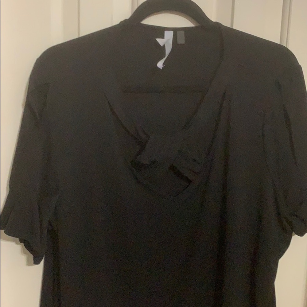 Black blouse. Crisscrossed cross neckline